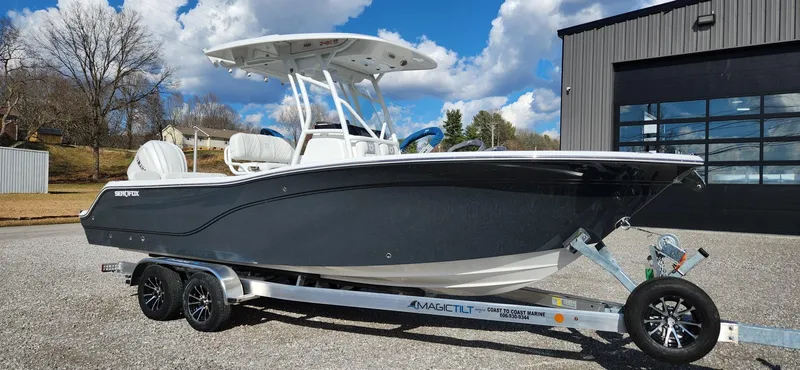 Slide: The Image of 2024 Sea Fox 248 Commander boat on trailer, parked outdoors under a blue sky. - 4