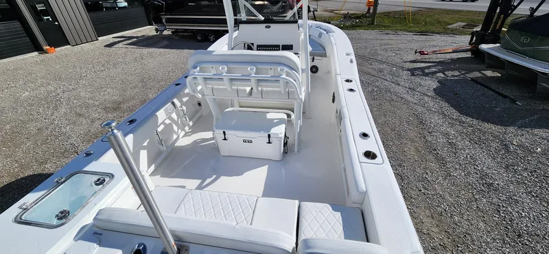 Slide: The Image of 2024 Sea Fox 248 Commander boat interior with seating and storage, displayed outdoors. - 5