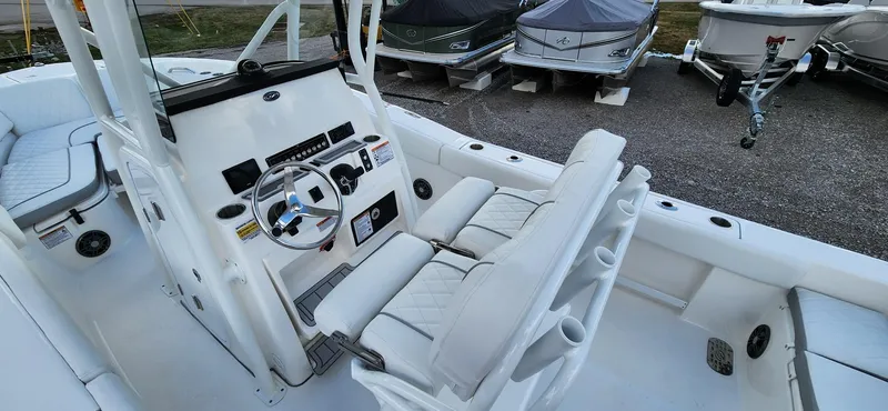 Slide: The Image of 2024 Sea Fox 248 Commander boat interior with steering console and seating. - 8