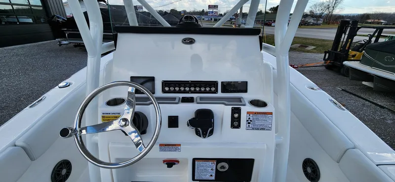 Slide: The Image of 2024 Sea Fox 248 Commander boat dashboard with steering wheel and controls. - 9