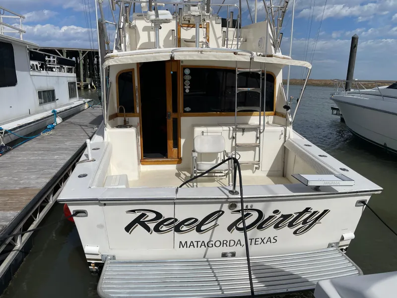 Slide: The Image of 1985 Ocean 38 Super Sport boat named "Reel Dirty" docked in Matagorda, Texas. - 2