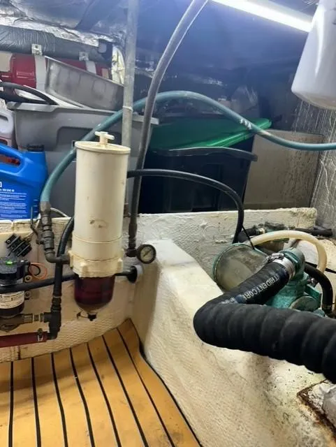 Slide: The Image of Engine compartment of a 1985 Ocean 38 Super Sport boat with fuel filter and hoses. - 34