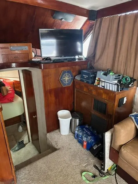 Slide: The Image of Interior of 1985 Ocean 38 Super Sport yacht with TV and storage. - 36