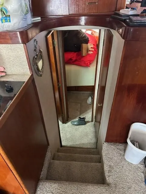 Slide: The Image of Stairway leading to cabin interior of 1985 Ocean 38 Super Sport yacht. - 38