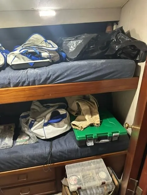 Slide: The Image of Interior of 1985 Ocean 38 Super Sport with bunk beds and storage. - 40