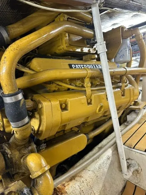 Slide: The Image of 1985 Ocean 38 Super Sport engine room with Caterpillar engine. - 44