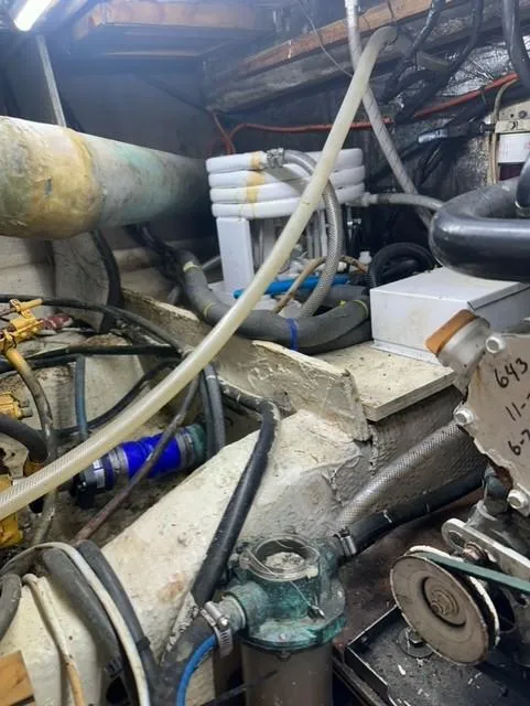 Slide: The Image of Engine room of a 1985 Ocean 38 Super Sport boat with various mechanical components. - 46