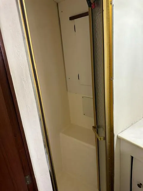 Slide: The Image of 1985 Ocean 38 Super Sport boat interior shower stall - 57