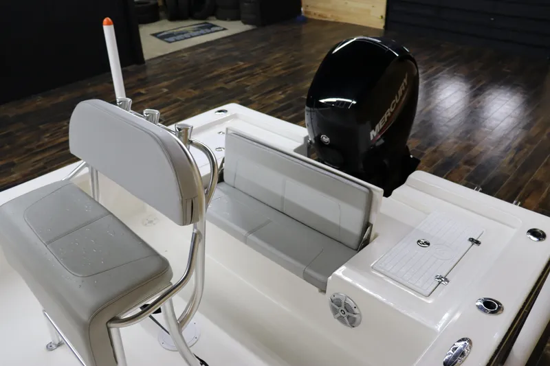 Slide: The Image of 2023 May-Craft 2200 Bay boat interior with Mercury engine and seating. - 12