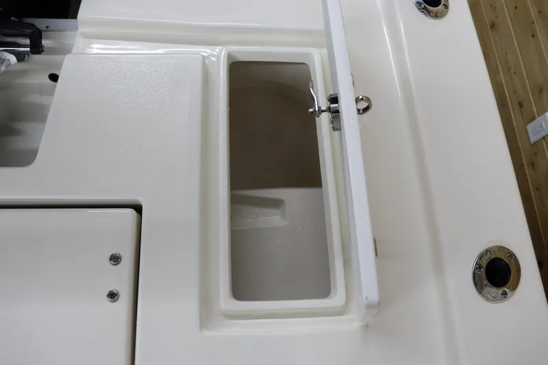 Slide: The Image of Open storage compartment on 2023 May-Craft 2200 Bay boat deck. - 13