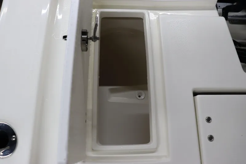 Slide: The Image of 2023 May-Craft 2200 Bay boat storage compartment, open and empty. - 14