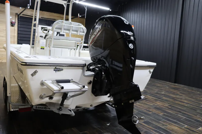 Slide: The Image of 2023 May-Craft 2200 Bay boat with Mercury outboard motor in showroom. - 5