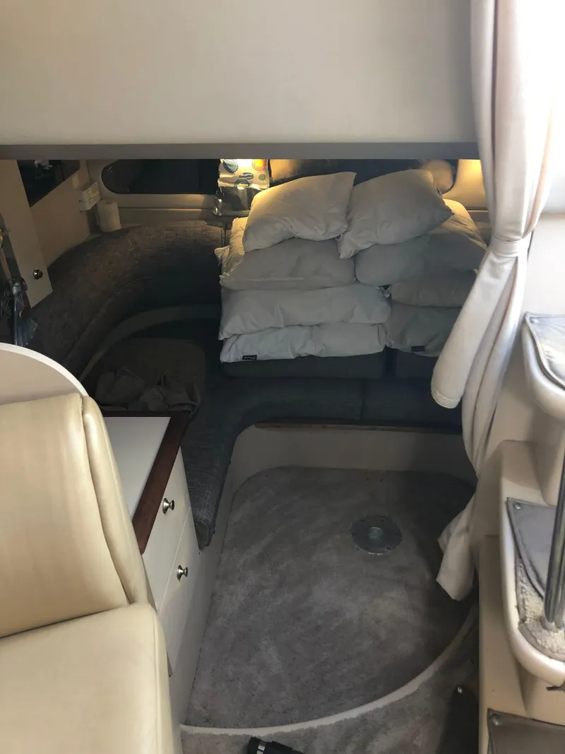 Slide: The Image of Interior cabin of 2000 Cruisers Yachts 3375 Express with seating and cushions. - 12