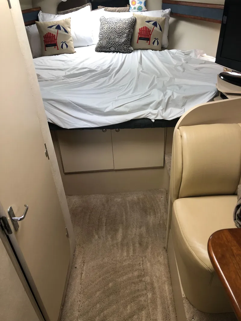 Slide: The Image of Interior cabin of 2000 Cruisers Yachts 3375 Express with bed and seating area. - 17
