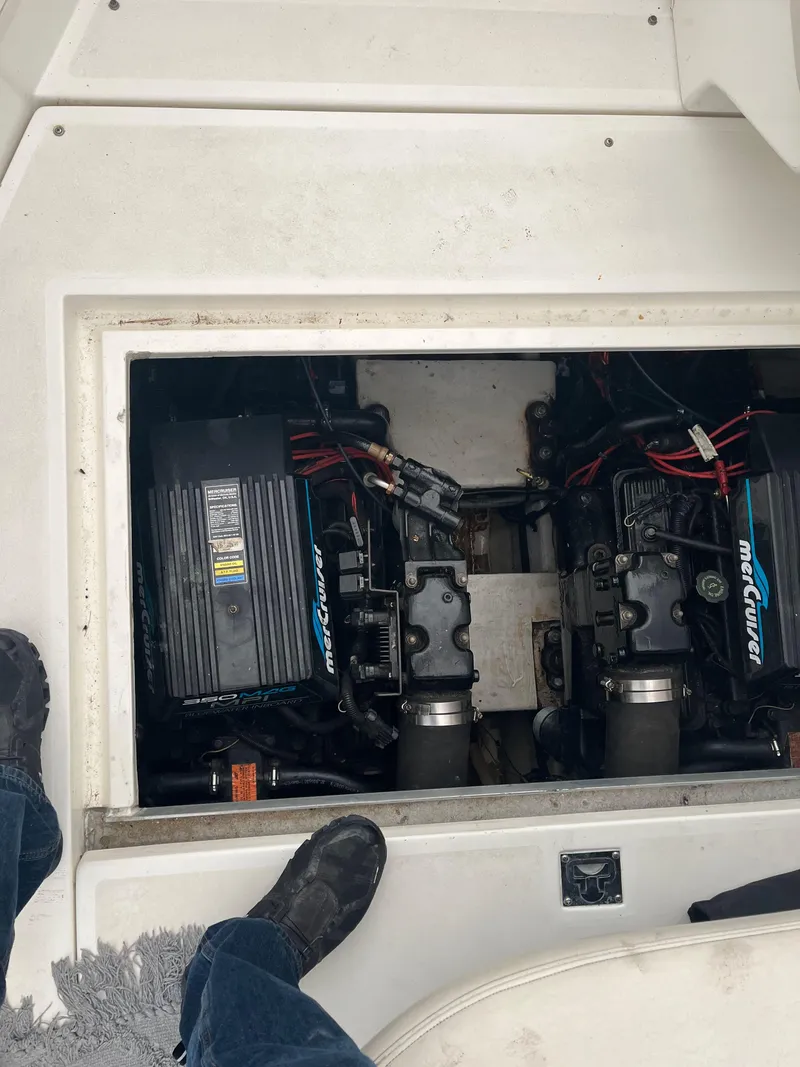 Slide: The Image of 2000 Cruisers Yachts 3375 Express engine compartment with twin MerCruiser engines. - 19