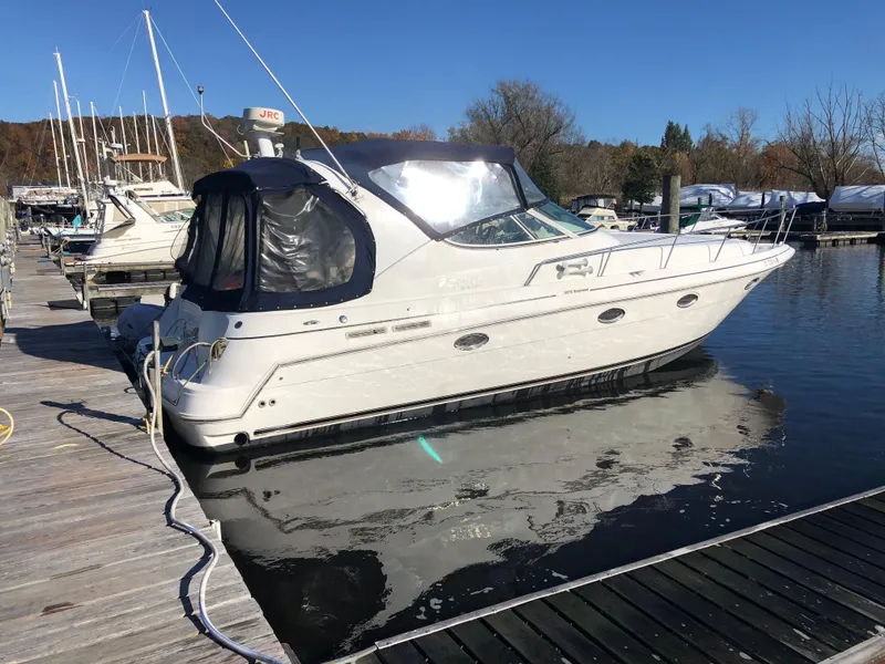 The Image of 2000 Cruisers Yachts 3375 Express docked at a marina. - 0