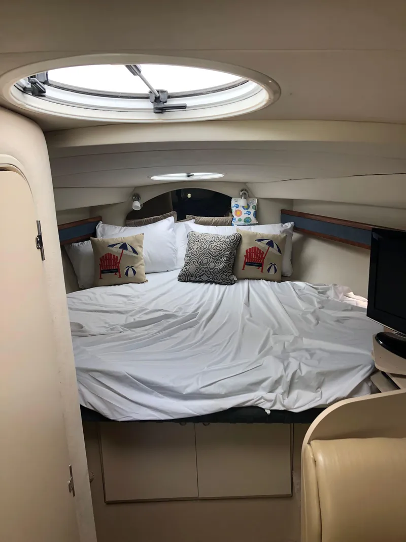 Slide: The Image of Interior cabin of 2000 Cruisers Yachts 3375 Express with bed and porthole. - 18