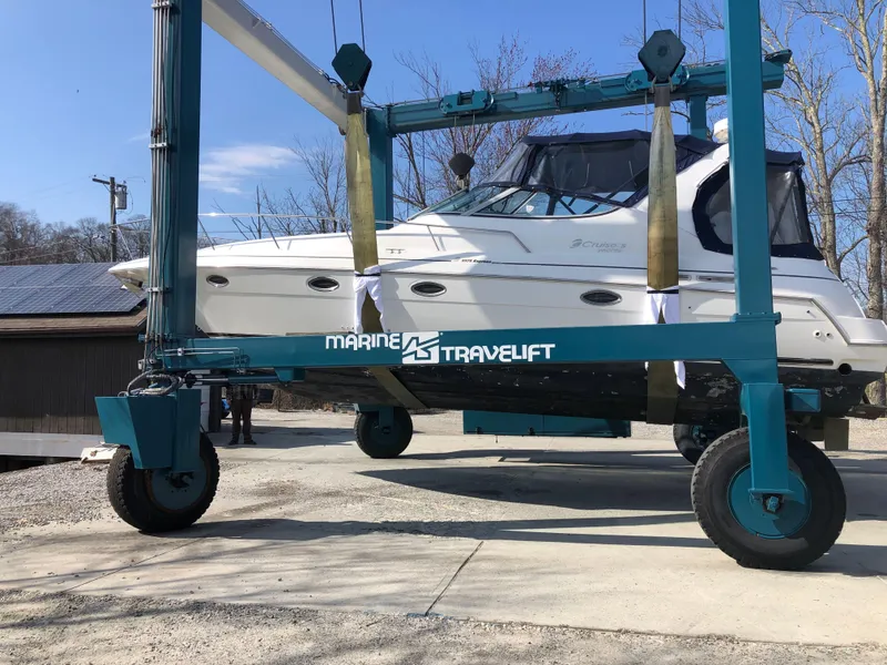 Slide: The Image of 2000 Cruisers Yachts 3375 Express on Marine Travelift for maintenance. - 6