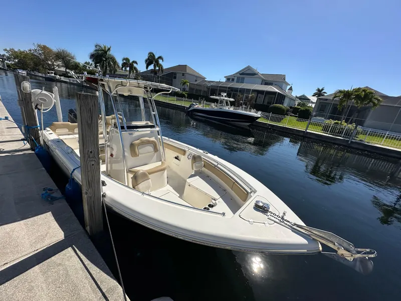 Slide: The Image of 2019 Key West 239 FS boat docked in a residential canal. - 0