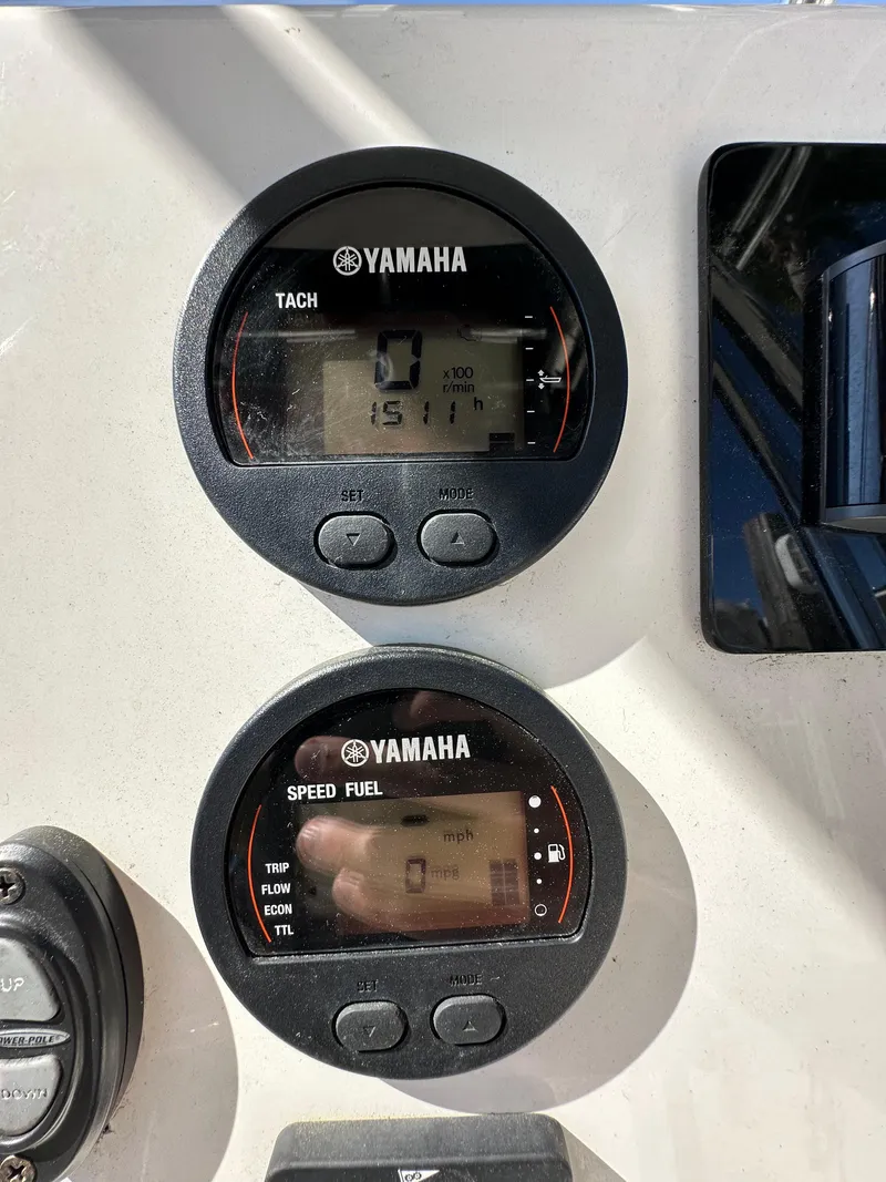 Slide: The Image of Yamaha tachometer and speed fuel gauges on a 2019 Key West 239 FS boat. - 12