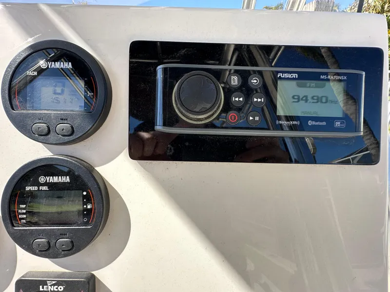 Slide: The Image of 2019 Key West 239 FS boat dashboard with Yamaha gauges and Fusion stereo. - 14