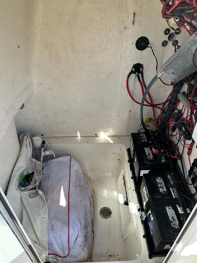 Slide: The Image of 2019 Key West 239 FS boat battery compartment with wiring. - 18