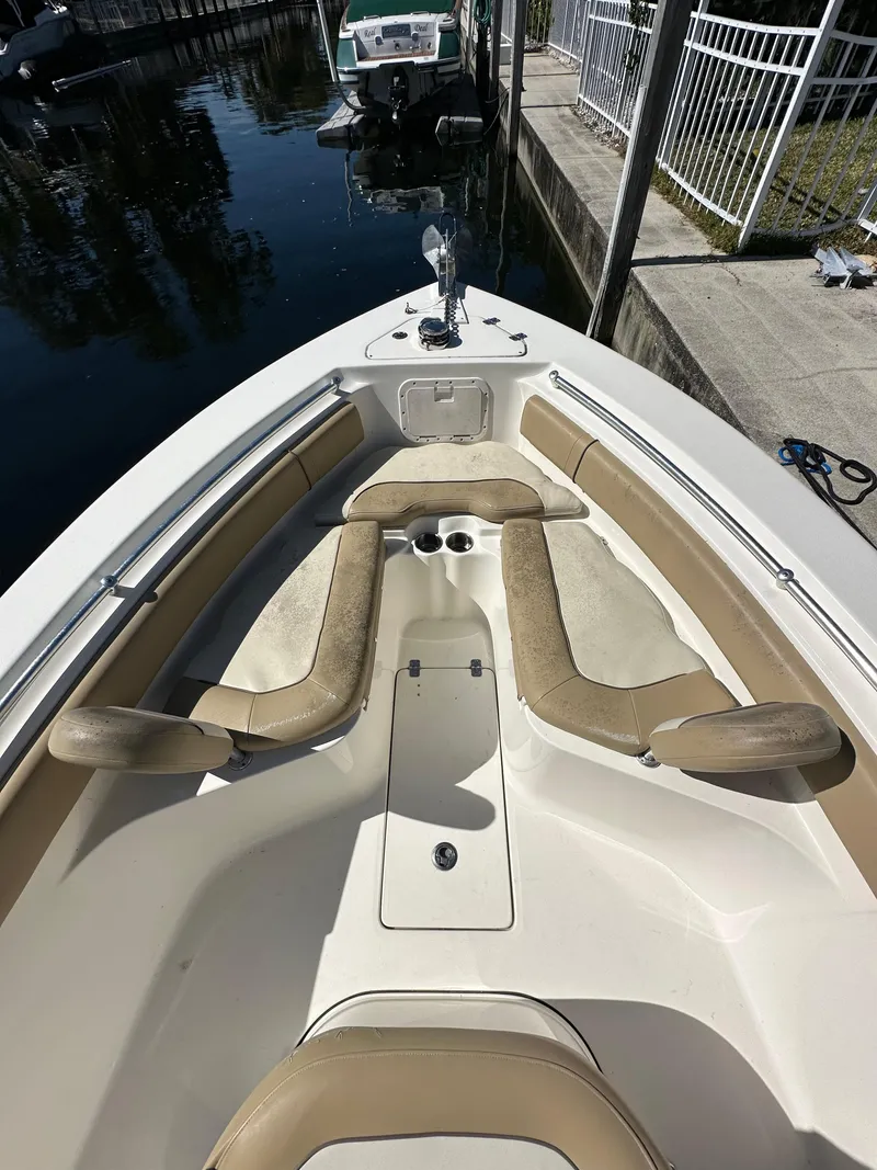 Slide: The Image of 2019 Key West 239 FS boat interior with seating and storage. - 19