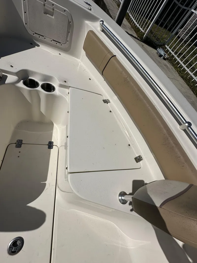 Slide: The Image of 2019 Key West 239 FS boat interior seating and storage compartments. - 22