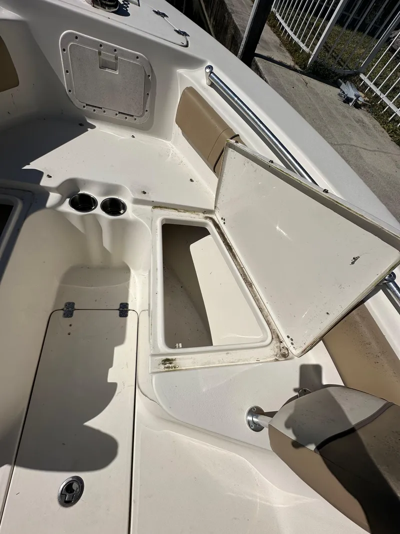 Slide: The Image of 2019 Key West 239 FS boat interior with open storage compartments. - 25