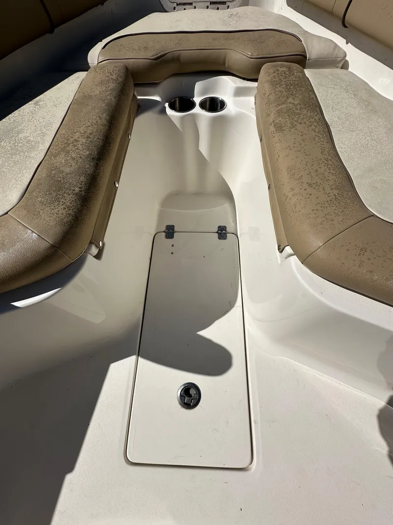 Slide: The Image of 2019 Key West 239 FS boat interior seating and storage compartment. - 26