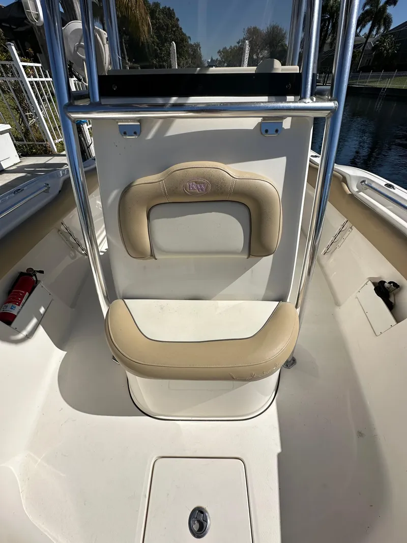 Slide: The Image of 2019 Key West 239 FS boat interior with seating and safety equipment. - 30