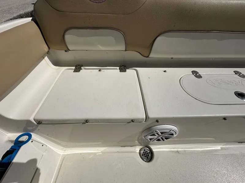 Slide: The Image of 2019 Key West 239 FS boat interior seating and storage compartments. - 37