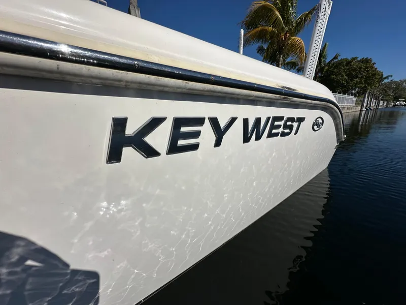 Slide: The Image of 2019 Key West 239 FS boat side view on water. - 4