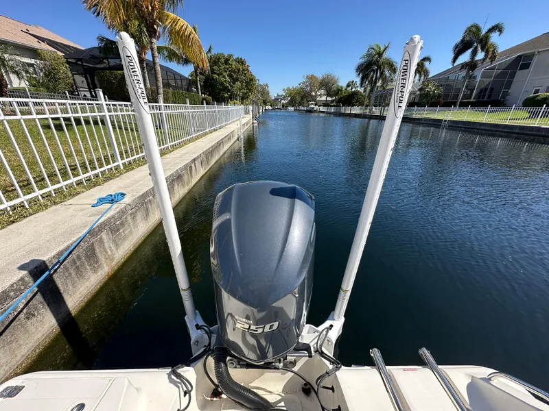 Slide: The Image of 2019 Key West 239 FS boat with Yamaha 250 engine in a canal. - 44