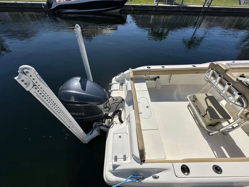Slide: The Image of 2019 Key West 239 FS boat with Yamaha outboard motor docked in calm water. - 5