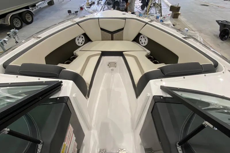 Slide: The Image of 2024 Monterey 215SS boat interior with cushioned seating and speakers. - 17
