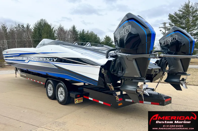Slide: The Image of MTI 390X 2022 on trailer with dual outboard motors. - 13