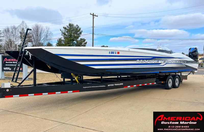 Slide: The Image of 2022 MTI 390X boat on trailer at American Custom Marine. - 16