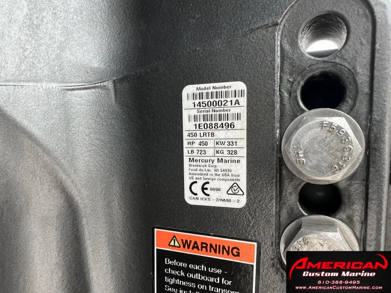 Slide: The Image of MTI 390X 2022 model number and warning labels on engine. - 18