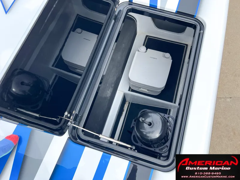 Slide: The Image of MTI 390X 2022 with open storage compartment and accessories. - 26