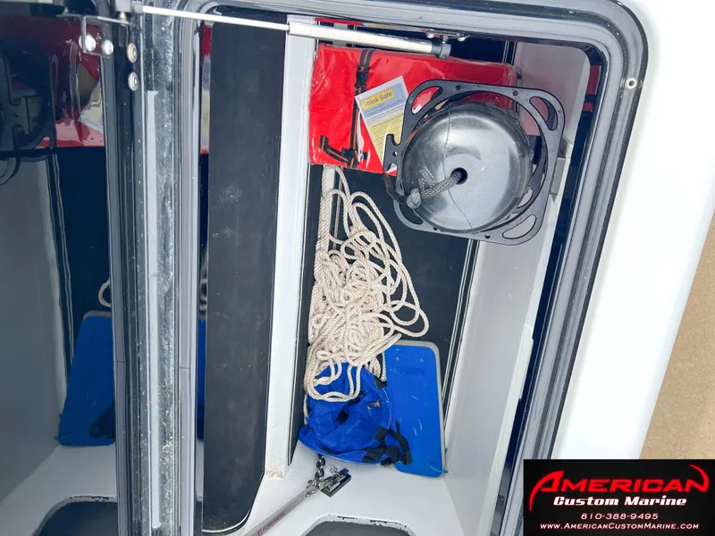 Slide: The Image of MTI 390X 2022 storage compartment with rope and accessories. - 27