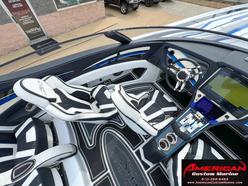 Slide: The Image of Interior of a 2022 MTI 390X boat with modern seats and controls. - 37
