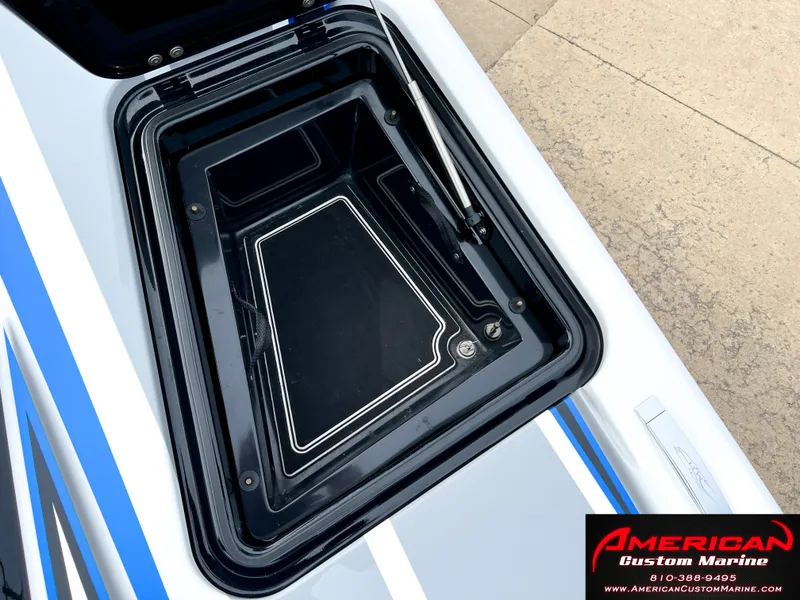 Slide: The Image of MTI 390X 2022 boat hatch with American Custom Marine logo. - 44