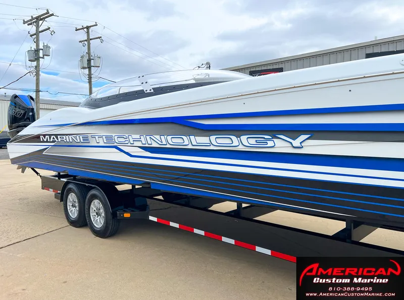Slide: The Image of MTI 390X boat 2022 on trailer at American Custom Marine. - 8