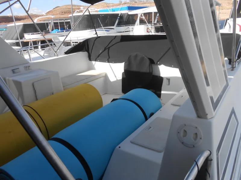 Slide: The Image of Interior view of 2000 Sumerset 7016 houseboat with colorful storage tubes. - 20