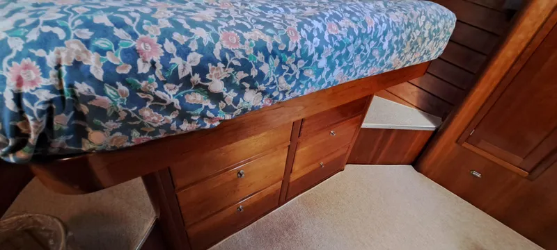 Slide: The Image of Interior of 1999 Rozema Boat Works Custom 40, featuring dining area and kitchen amenities. - 15