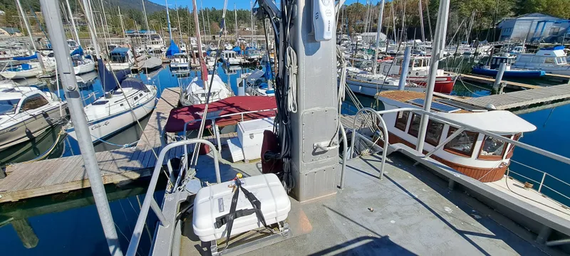 Slide: The Image of Rozema Boat Works Custom 42 (1999) docked in a marina with other boats. - 2