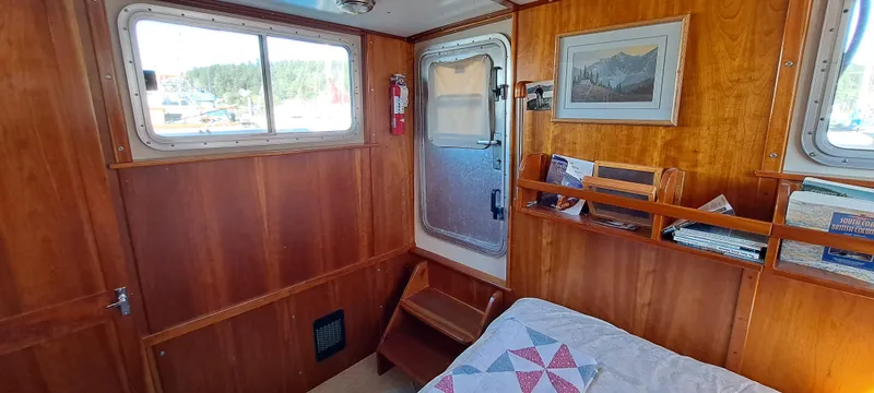 Slide: The Image of Bathroom interior of 1999 Rozema Boat Works Custom 40, featuring wooden cabinetry and sink. - 22