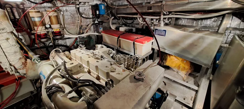 Slide: The Image of Engine room of a 1999 Rozema Boat Works Custom 42, showcasing machinery and components. - 35
