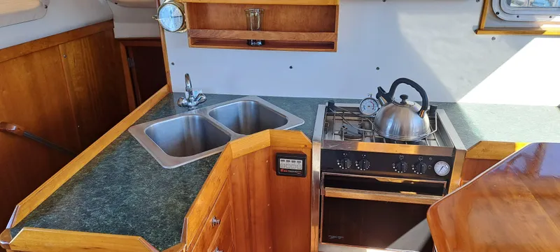 Slide: The Image of 1999 Rozema Boat Works Custom 42 bathroom with toilet and shower - 7